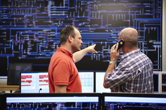 Fluvius employees in control center