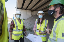 Fluvius employees at a site meeting