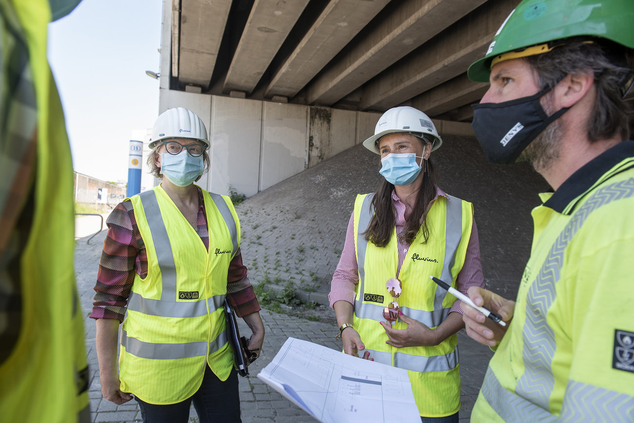 Fluvius employees at a site meeting